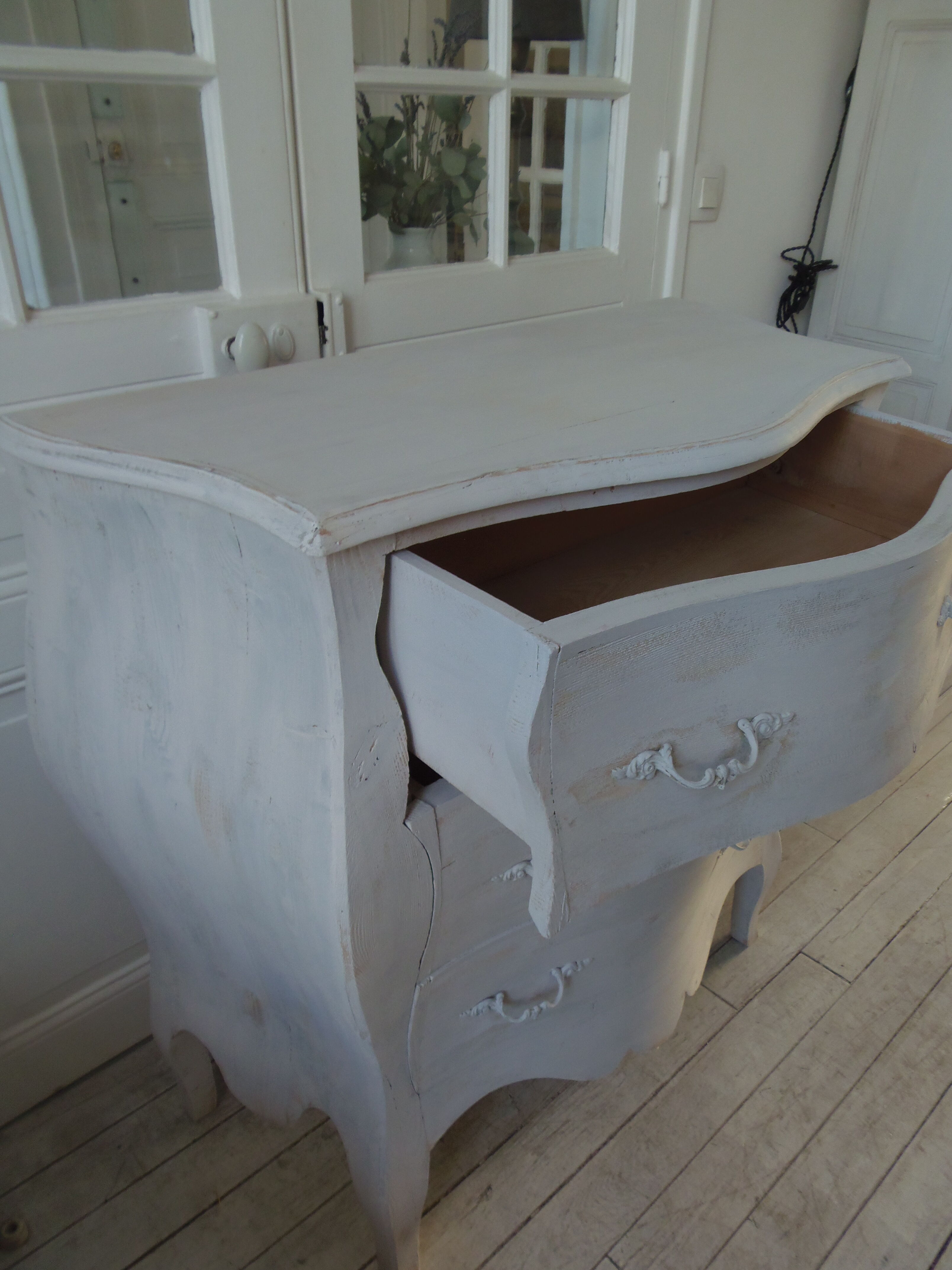 Curved patinated chest of drawers pearl grey waxed finish