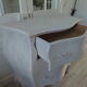Curved patinated chest of drawers pearl grey waxed finish