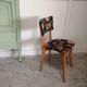 2 black scandinavian chairs and flowers