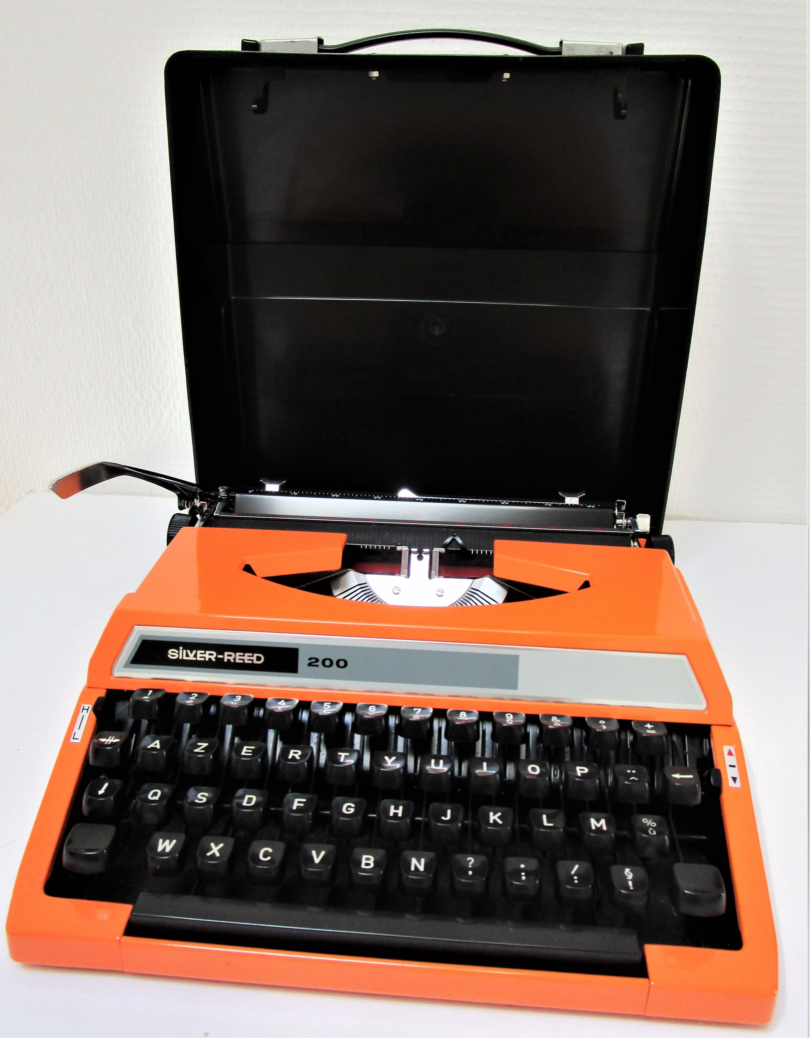 Silver Reed 200 orange metal typewriter made in Japan 70s