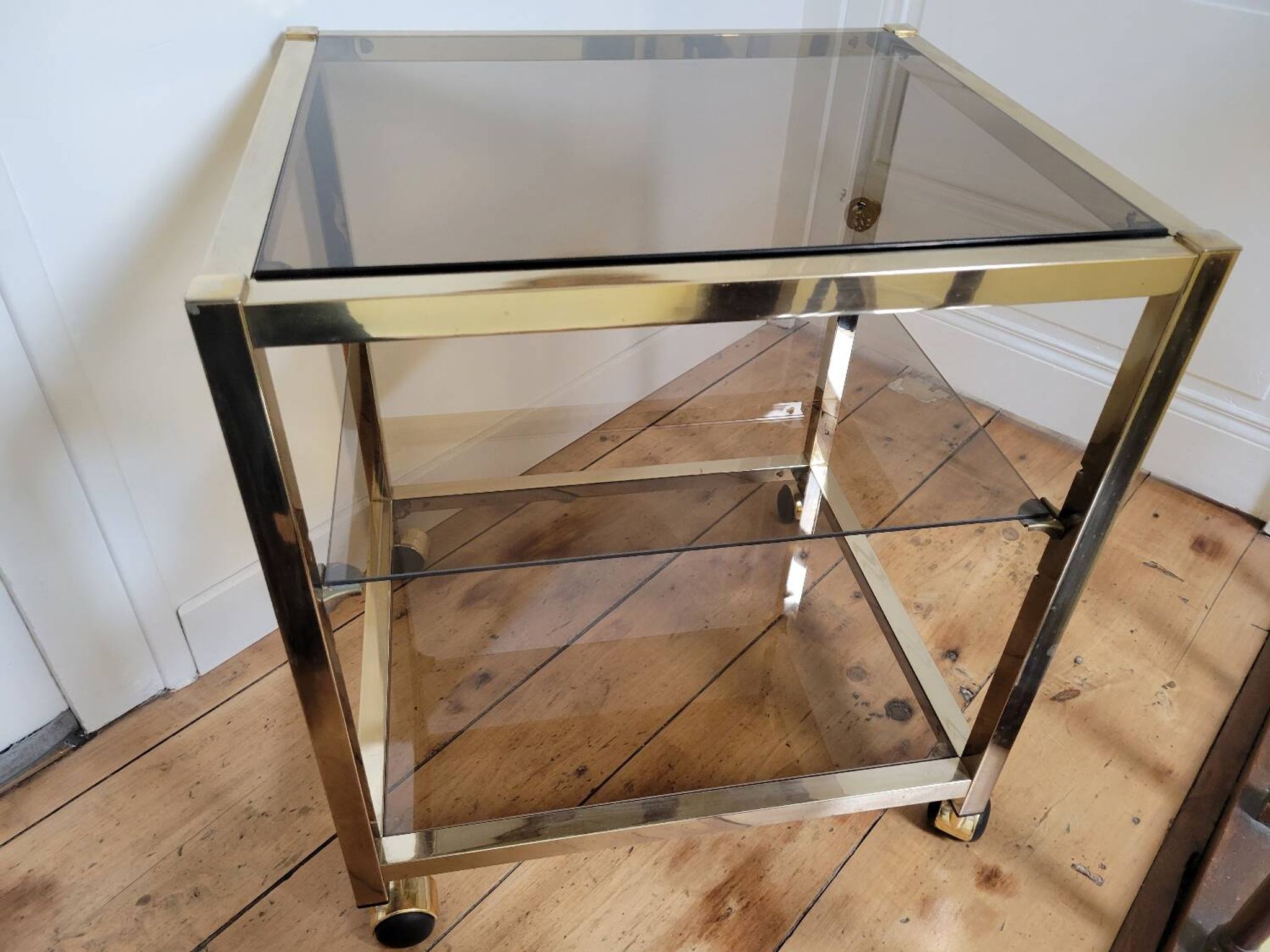 Gold metal and smoked glass serving trolley