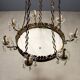 Antique chandelier in gilded bronze with neoclassical decorations from the 19th century.