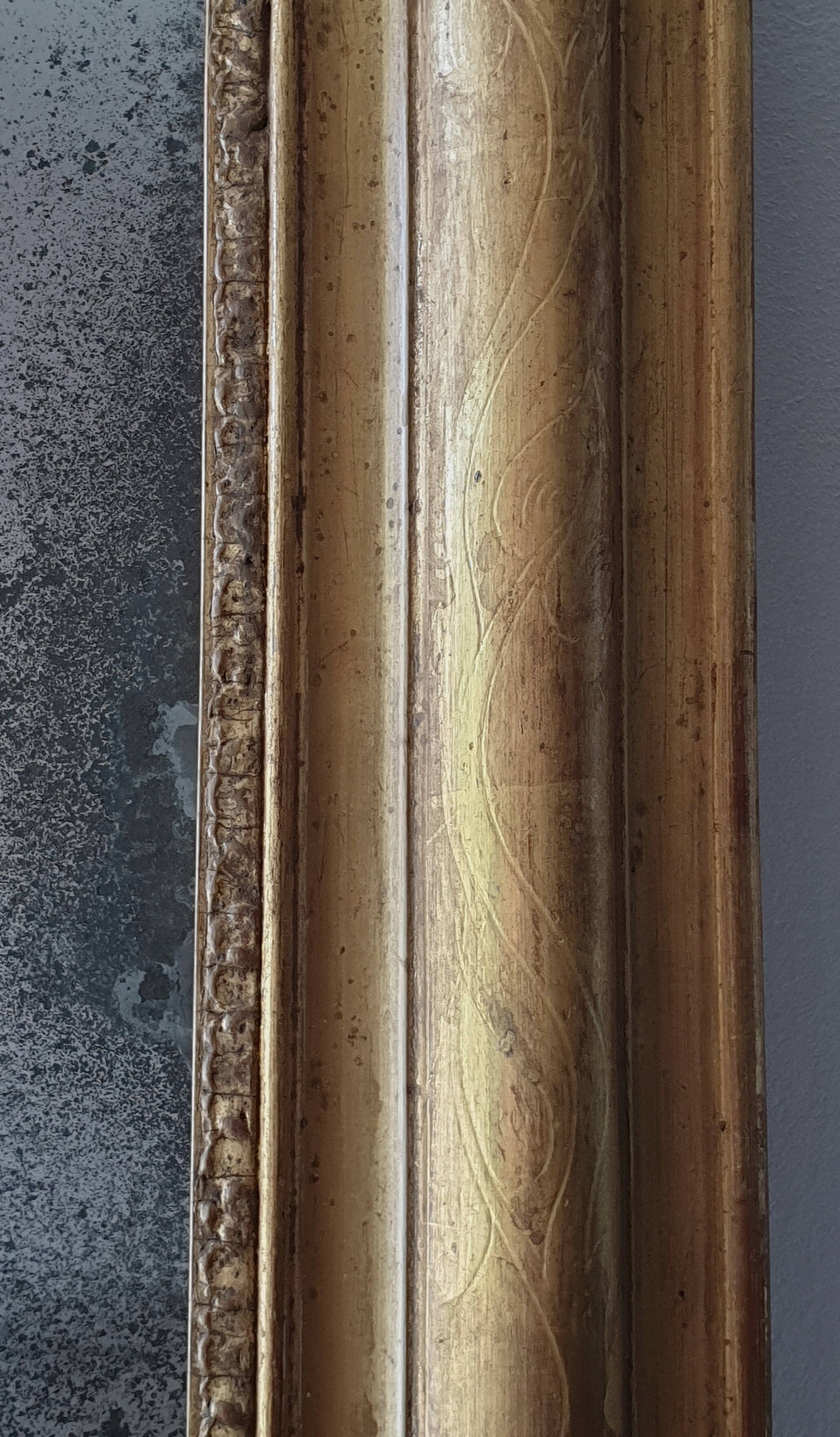 Old gilded mirror and old mercury glass - wall mirror with gold leaf