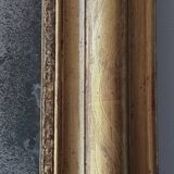 Old gilded mirror and old mercury glass - wall mirror with gold leaf