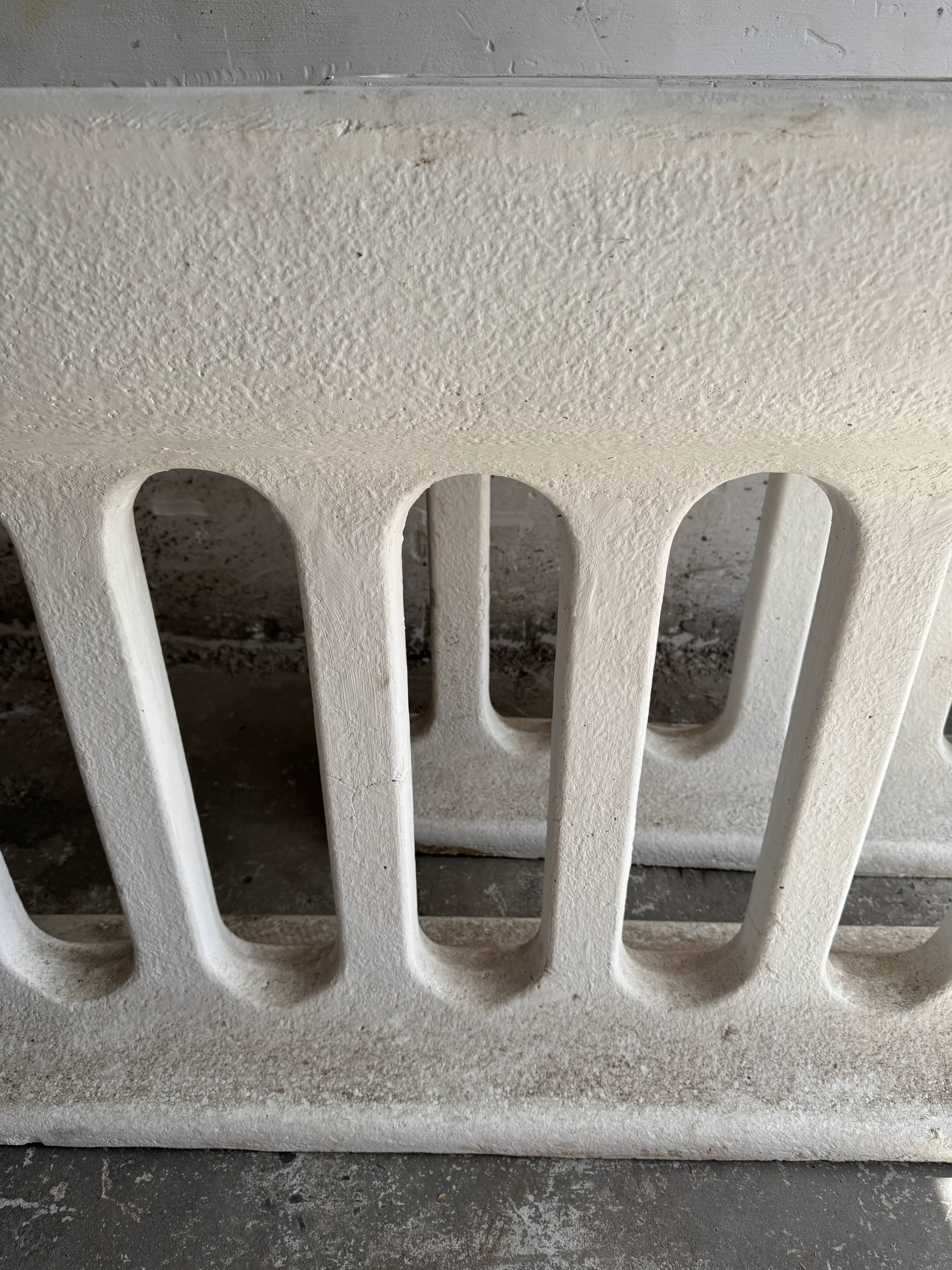 Pair of sculptural cast concrete planters in Off-White, mid-century brutalist style, long and rectangular.