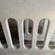 Pair of sculptural cast concrete planters in Off-White, mid-century brutalist style, long and rectangular.