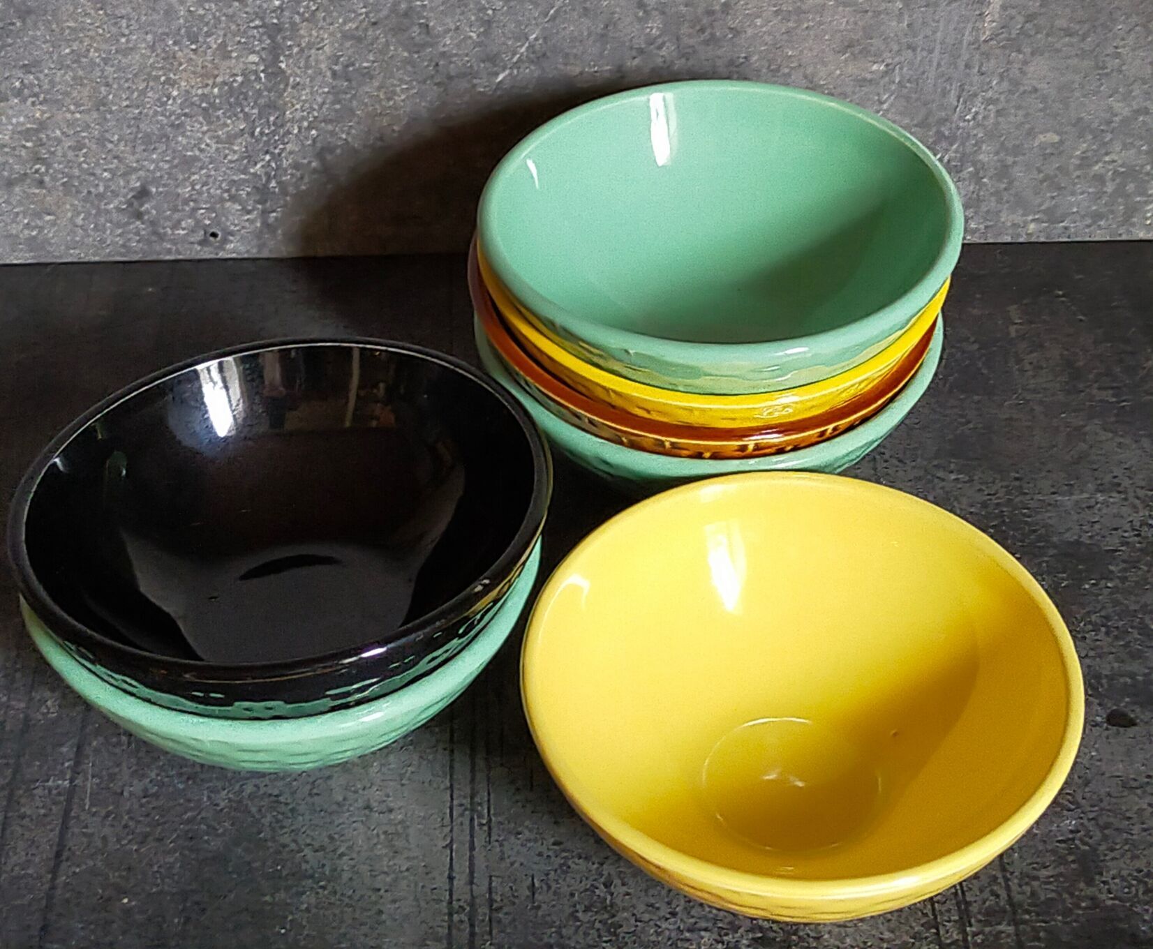 Seven vintage slip ceramic bowls