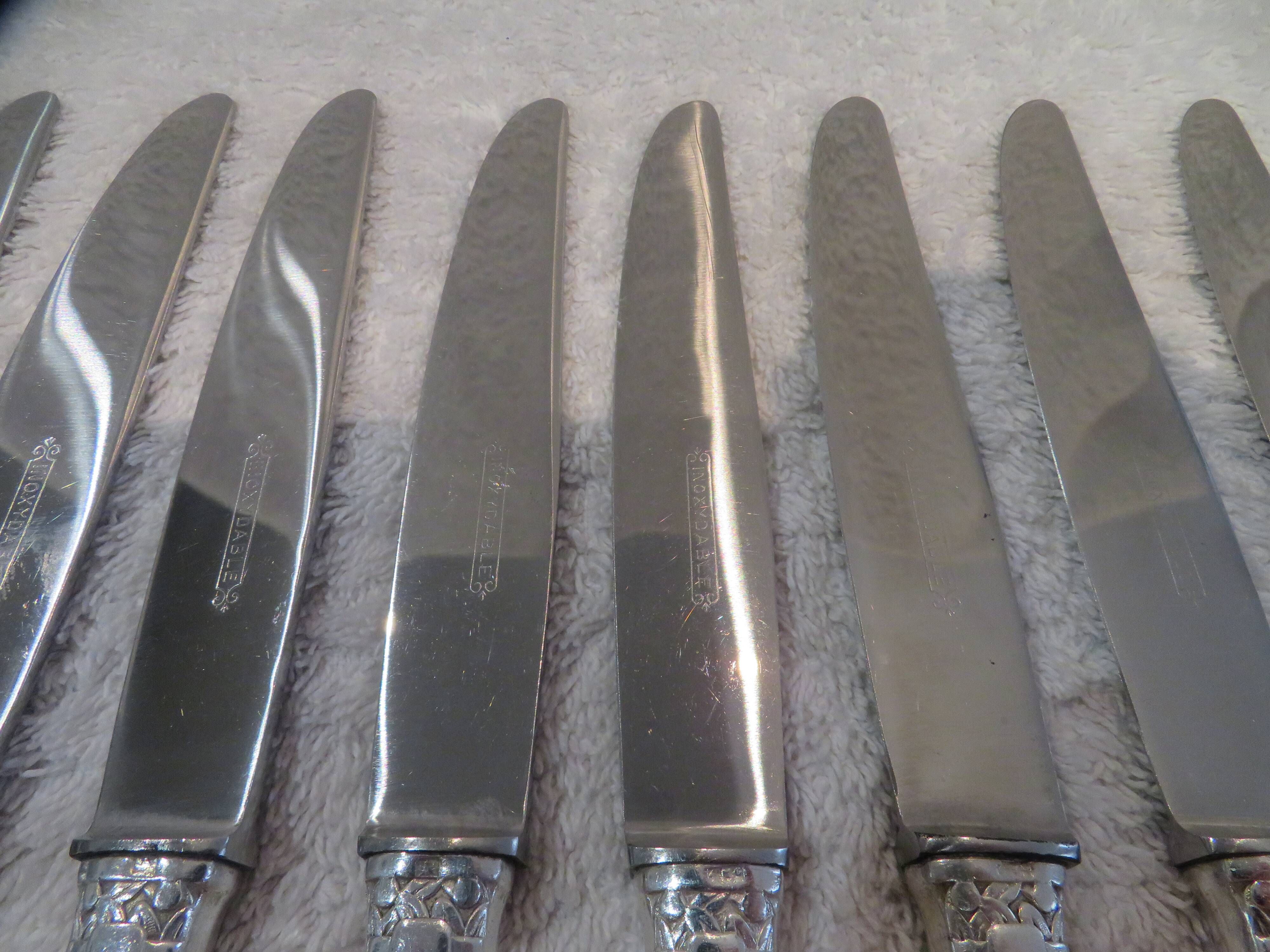 12 silver-plated dessert knives by Argit goldsmith? Art Deco floral bands