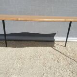 Violin-shaped coffee table with brass legs