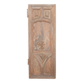 Paneled and carved wooden cupboard door