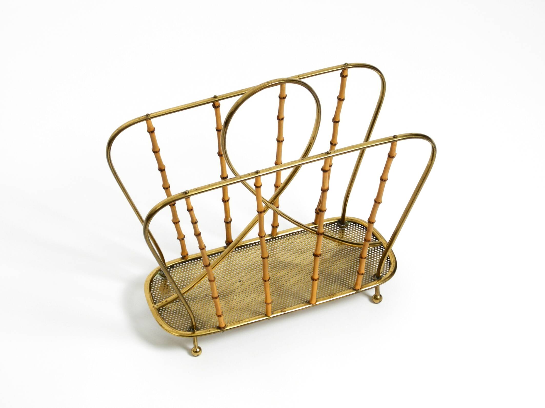 Rare Mid Century Modern magazine rack made of solid brass and genuine bambo