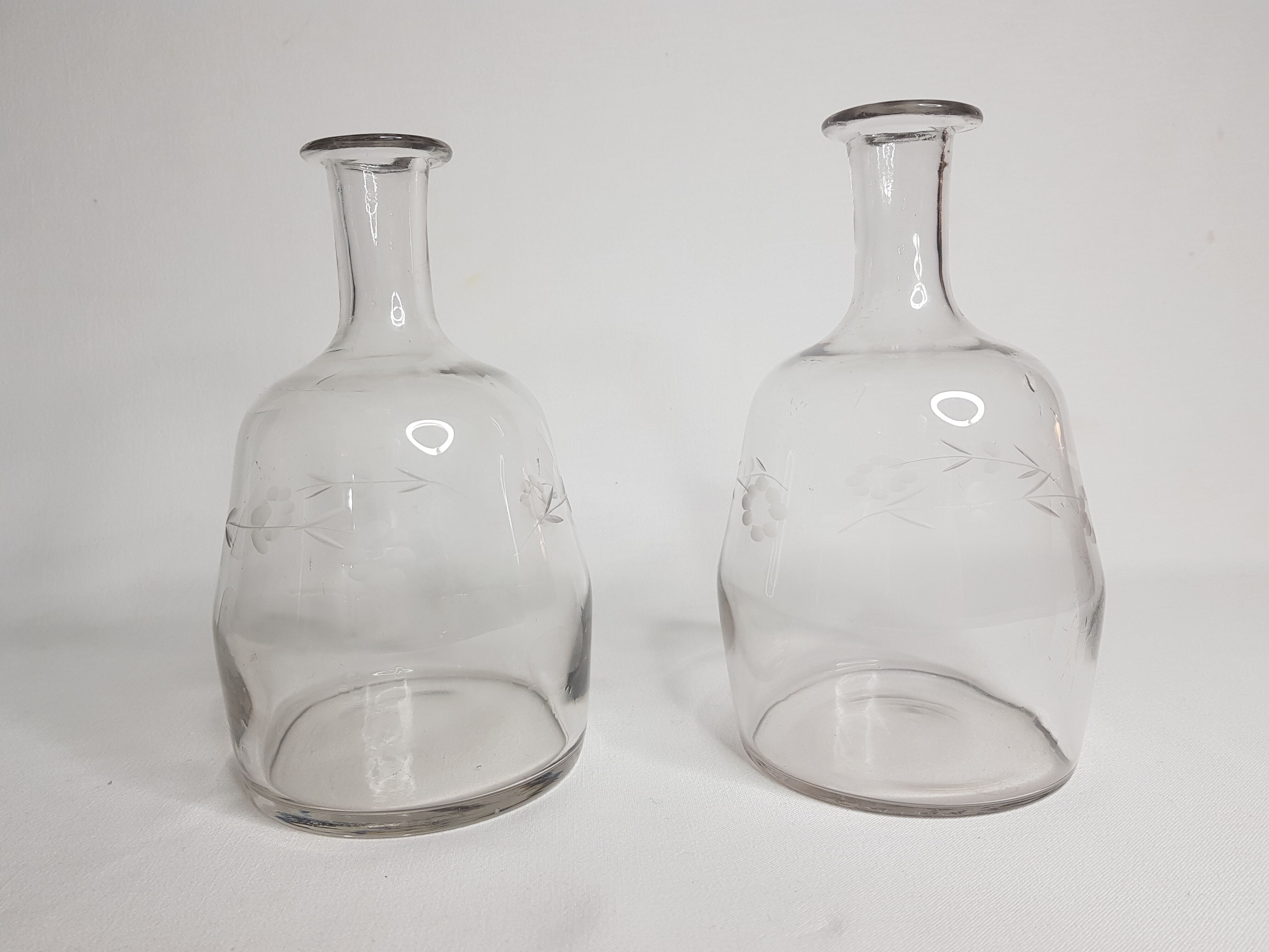Pair of blown glass decanters and cut with flowers
