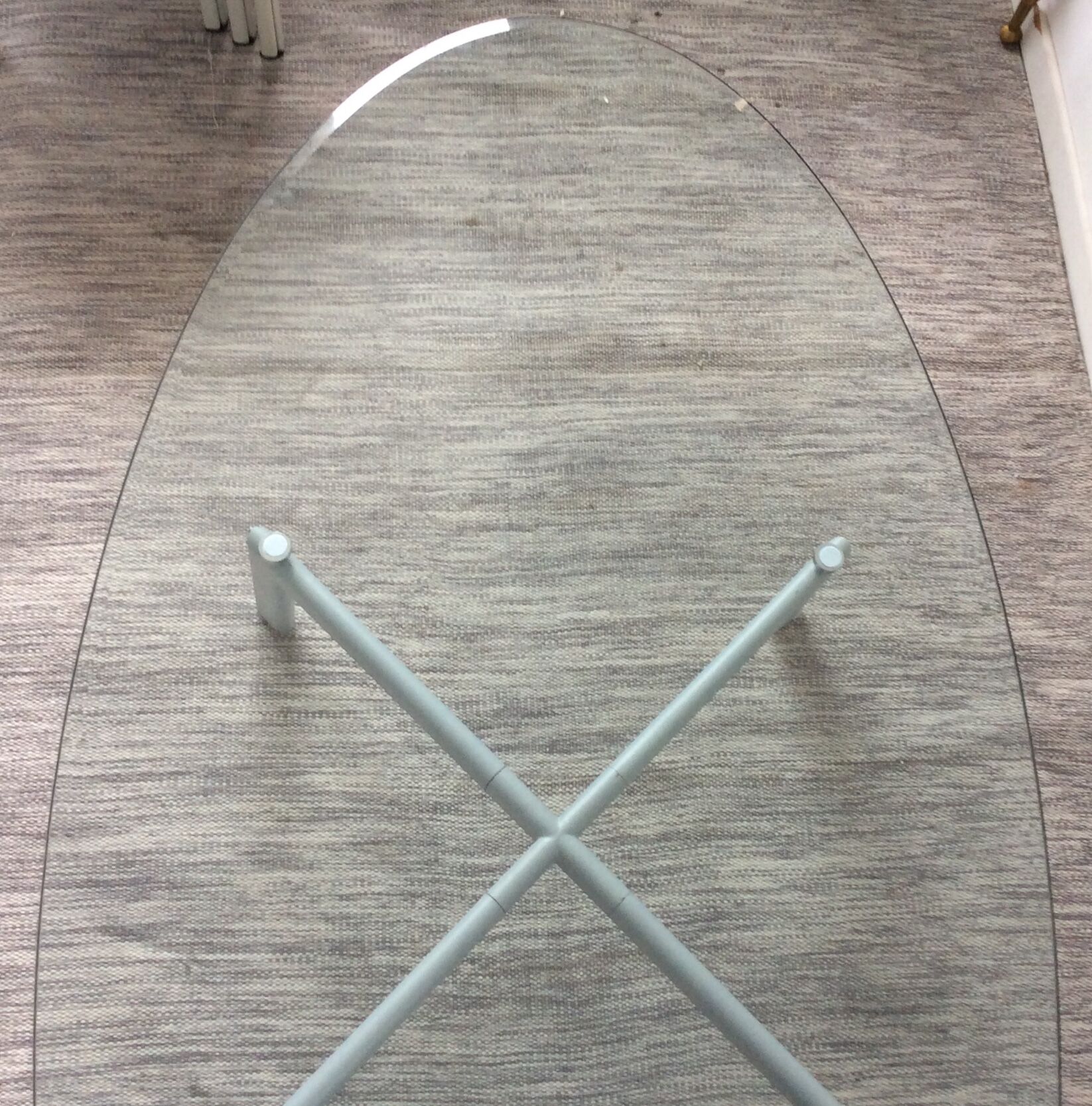 Design coffee table in beveled glass and steel foot