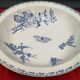 Flat round hollow earthenware Sarreguemines model Carmen Papillon