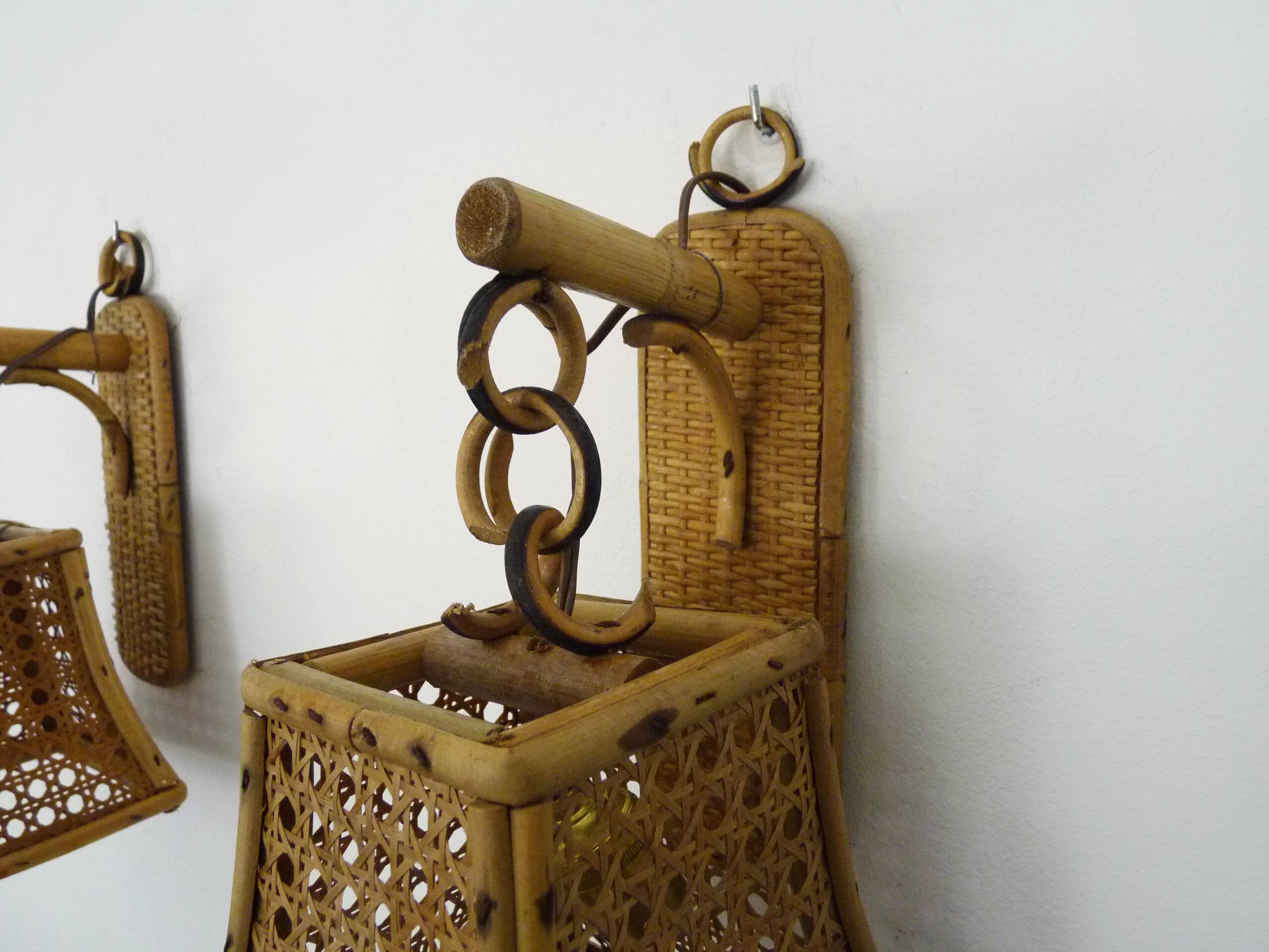 Pair of rattan and cane lantern wall lights. 1950s-1960s