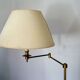 Articulated brass floor lamp