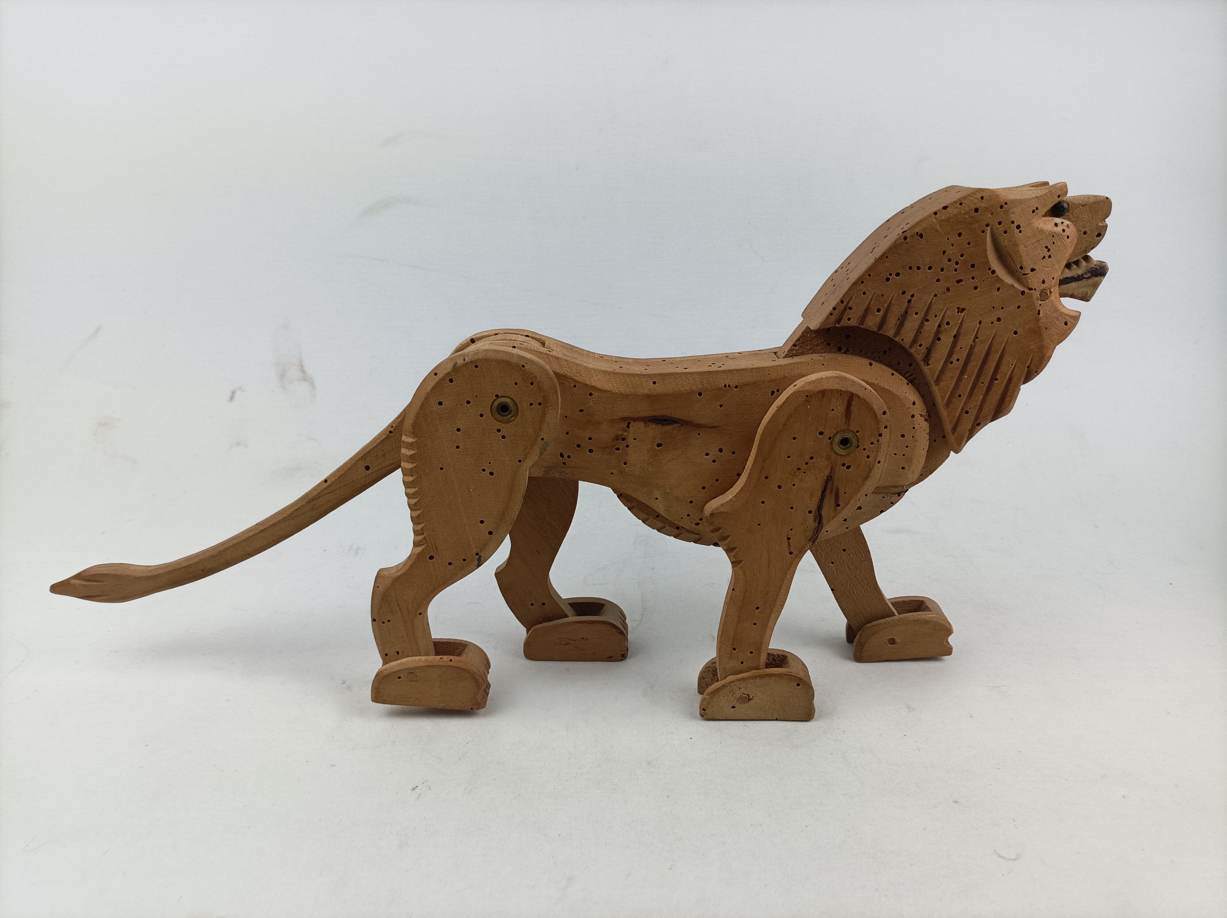 Articulated wooden lion