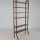 Danish freestanding wall rack with brass accents, 1960s