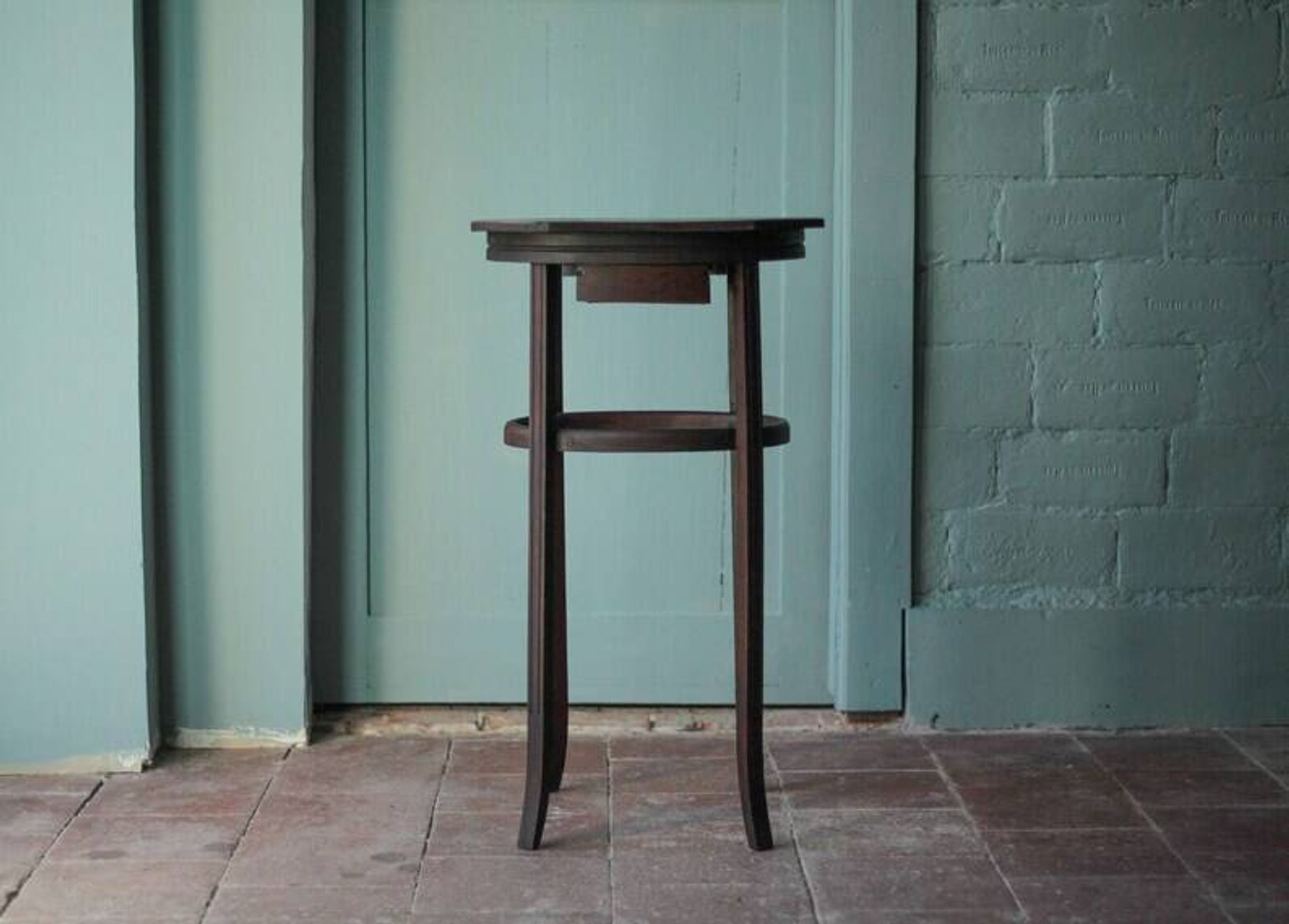 Wooden drawer table or 19th-century work table with a curved wooden stretcher, in the style of Thonet, circa 1900-1920.