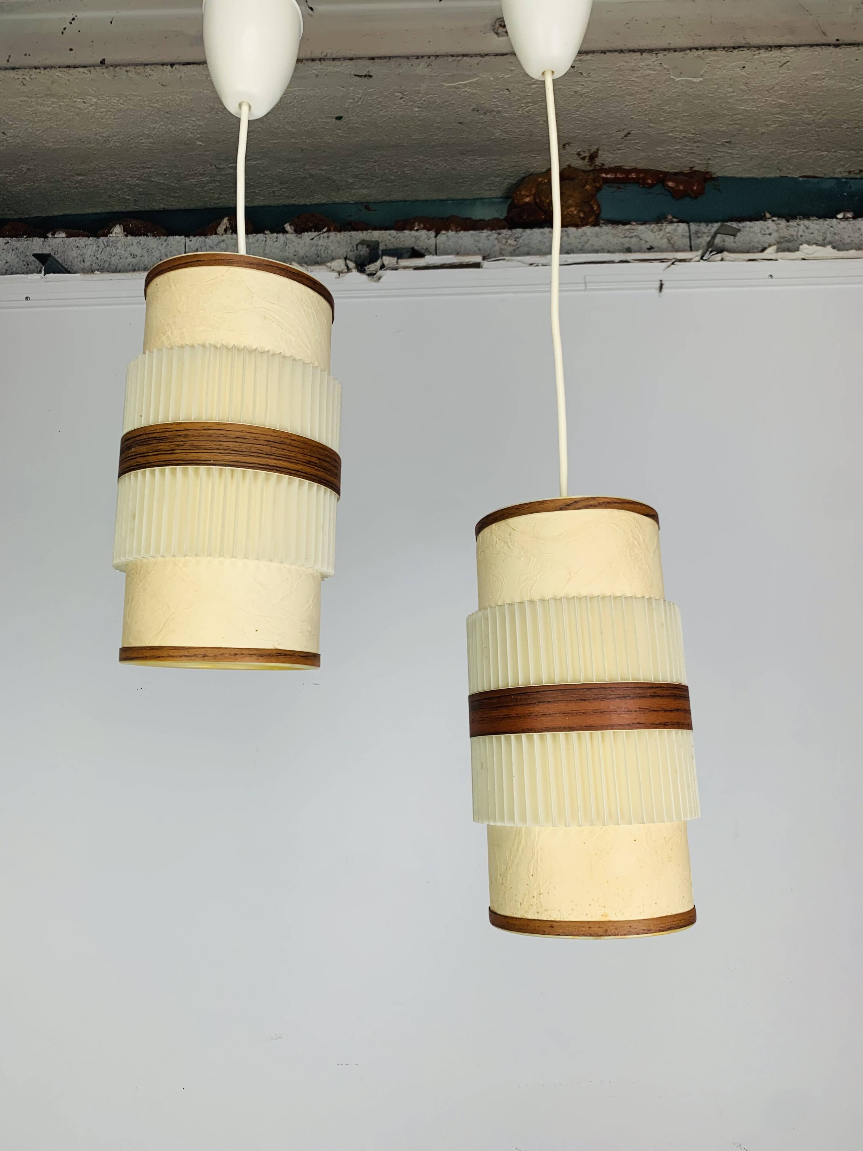 Pair of roller suspensions from the 70s, paper