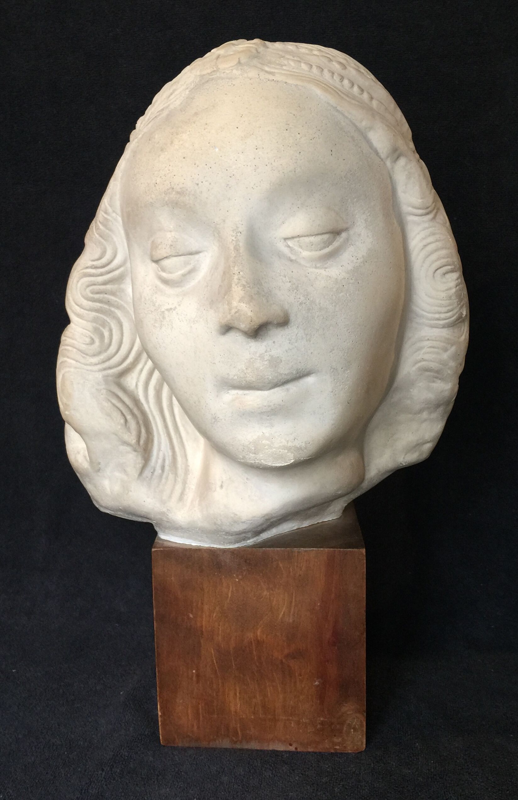 Bronze-middle-aged woman's head in plaster