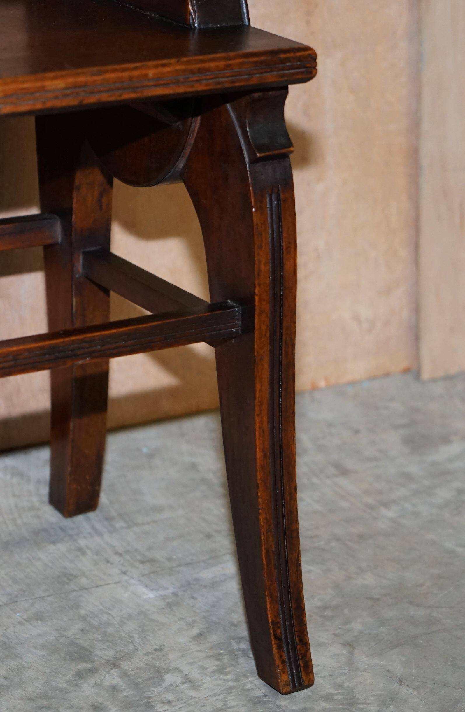 Antique entrance bench by Jas Shoolbred with brass fittings and walnut frame circa 1890.
