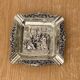 Antique silver-plated ashtray, decorated with repoussé scenes of a tavern, pin tray.