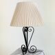 Vintage wrought iron table lamp in swirl shape with pleated shade