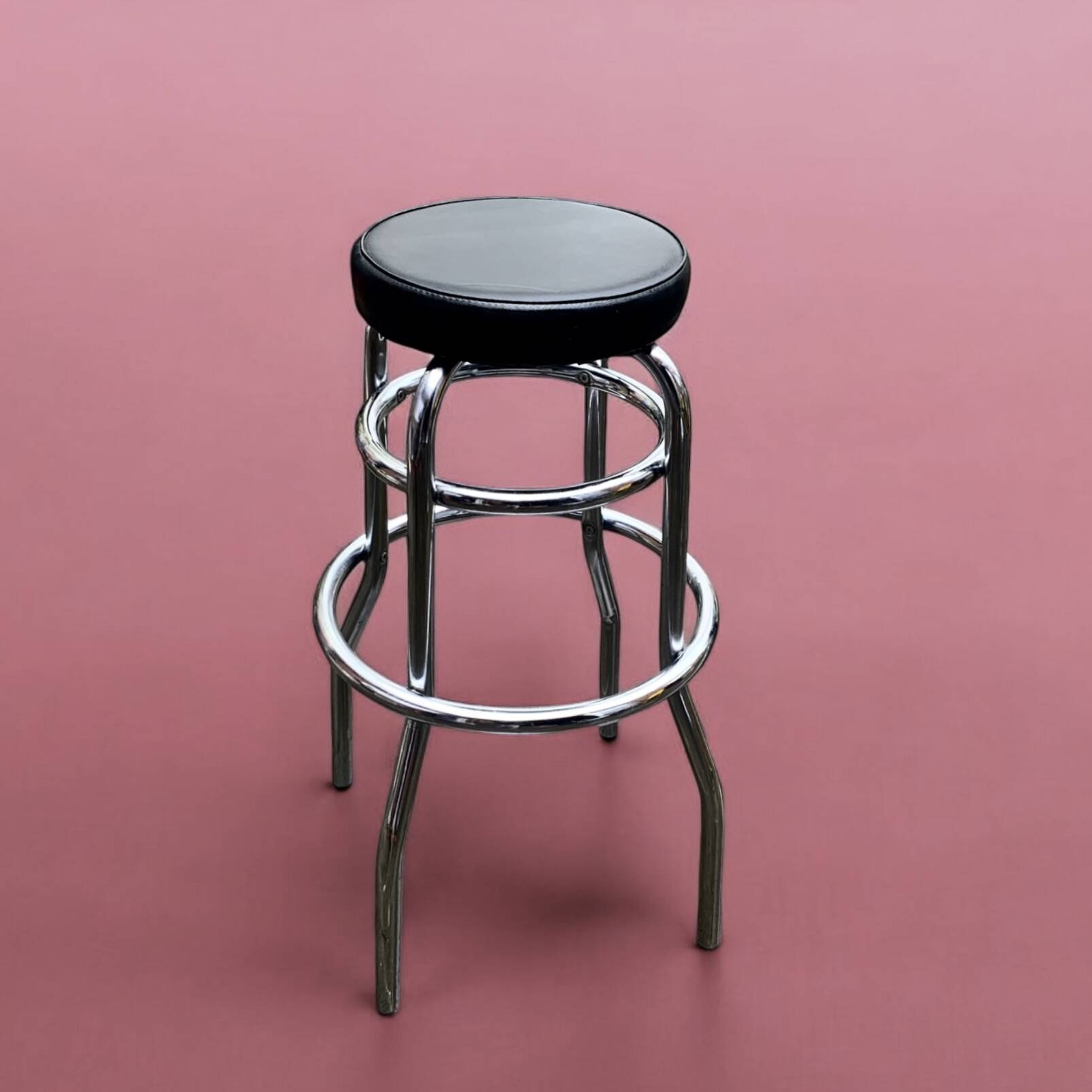 Vintage bar stool in black skai and chrome metal