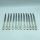 12 silver metal knives.