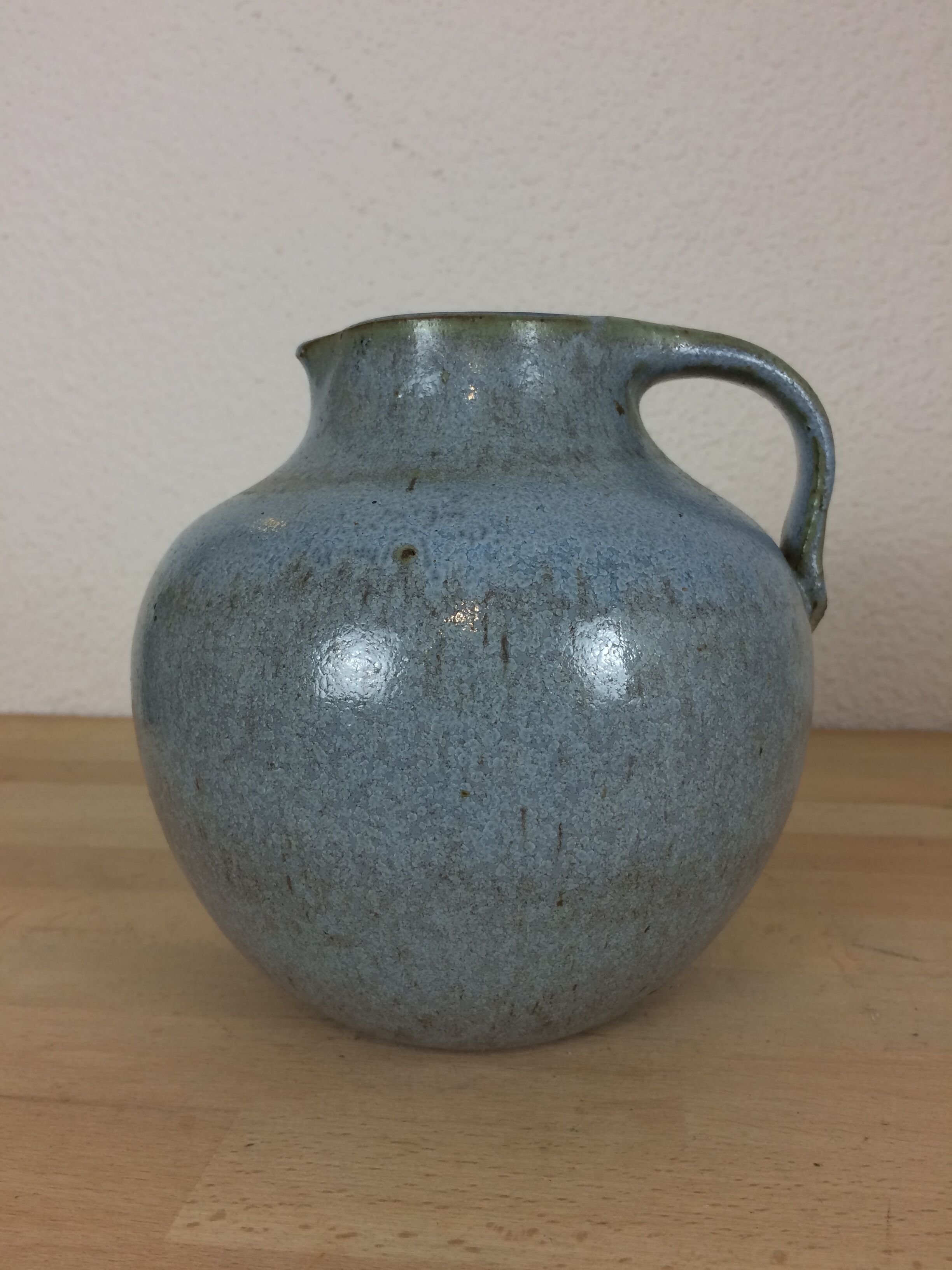 Blue ceramic ball vase signed