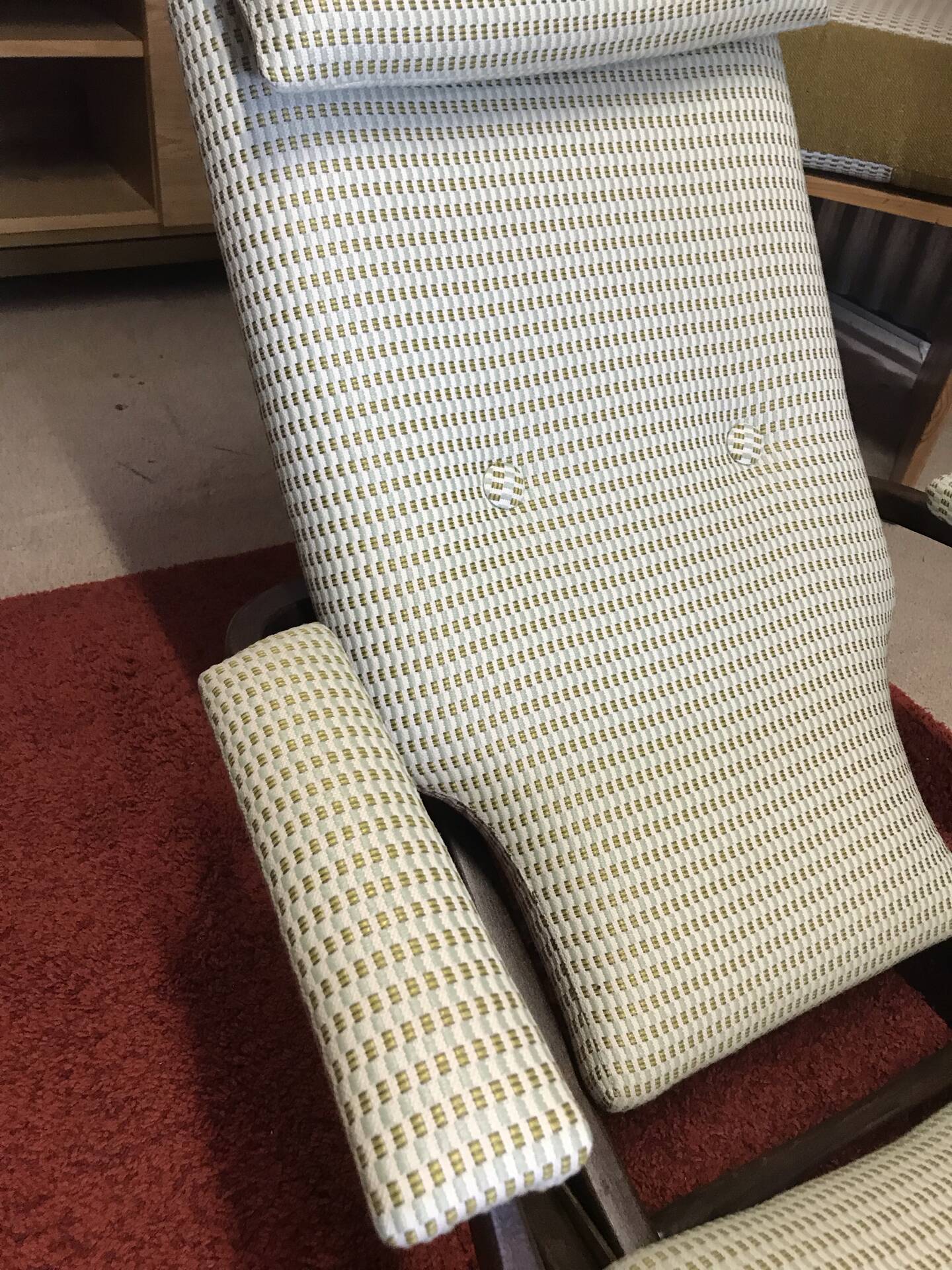 Rocking lounge chair made of fabric suitable for outdoor use.