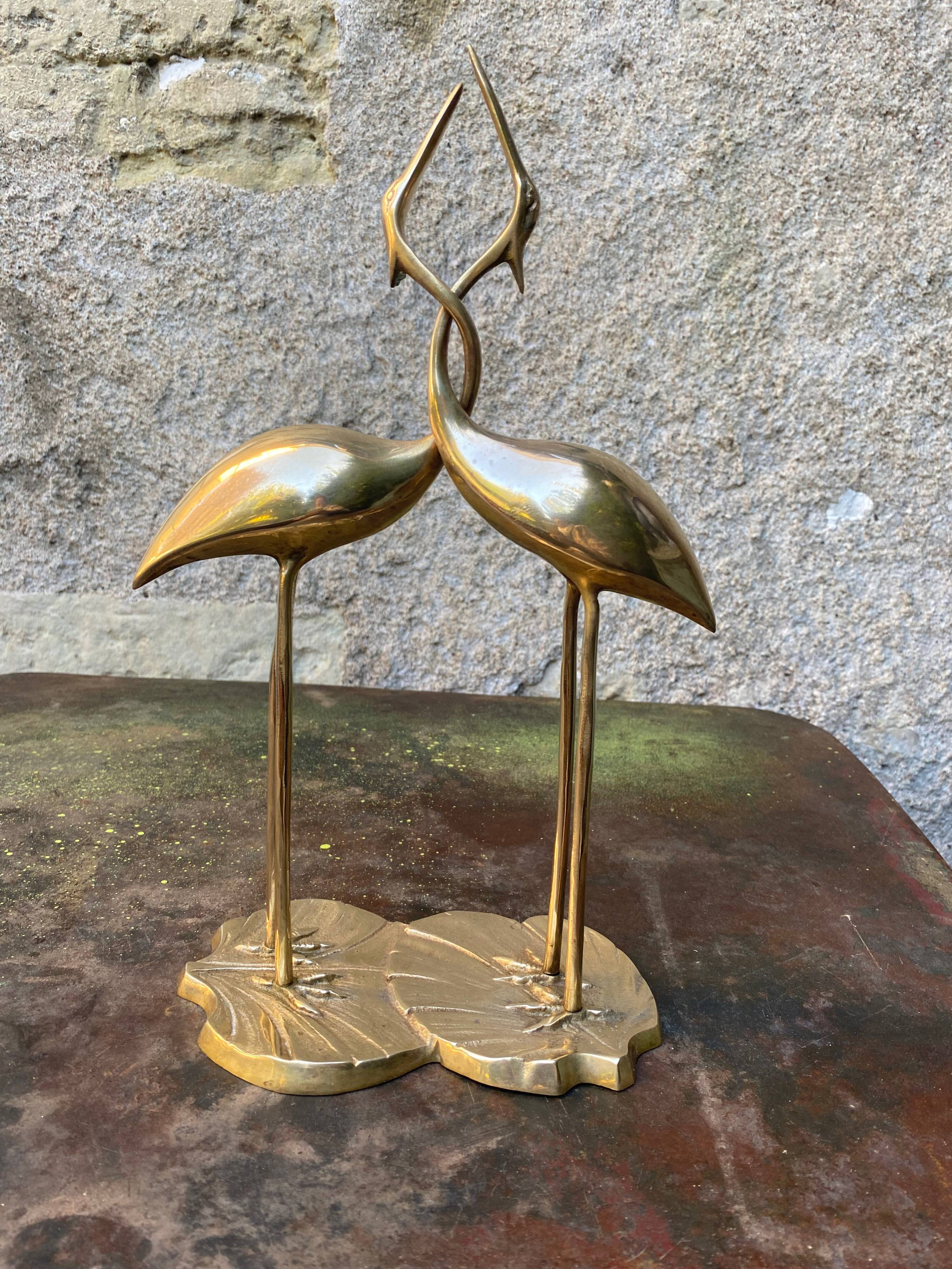 Couple of brass herons