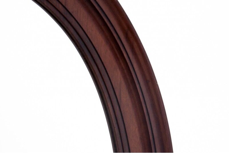 Oval mirror in a mahogany frame, Northern Europe, late 19th century.