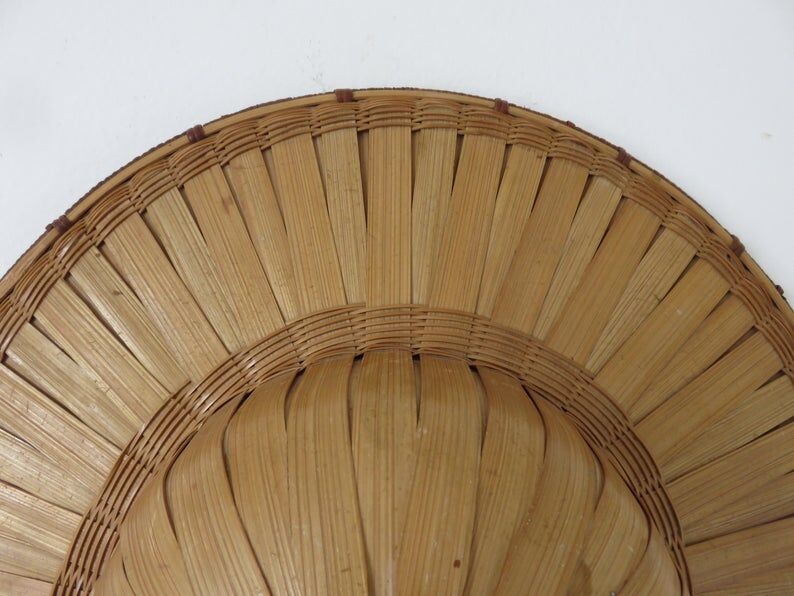 Colonial hat in bamboo and braided rattan, wall decoration