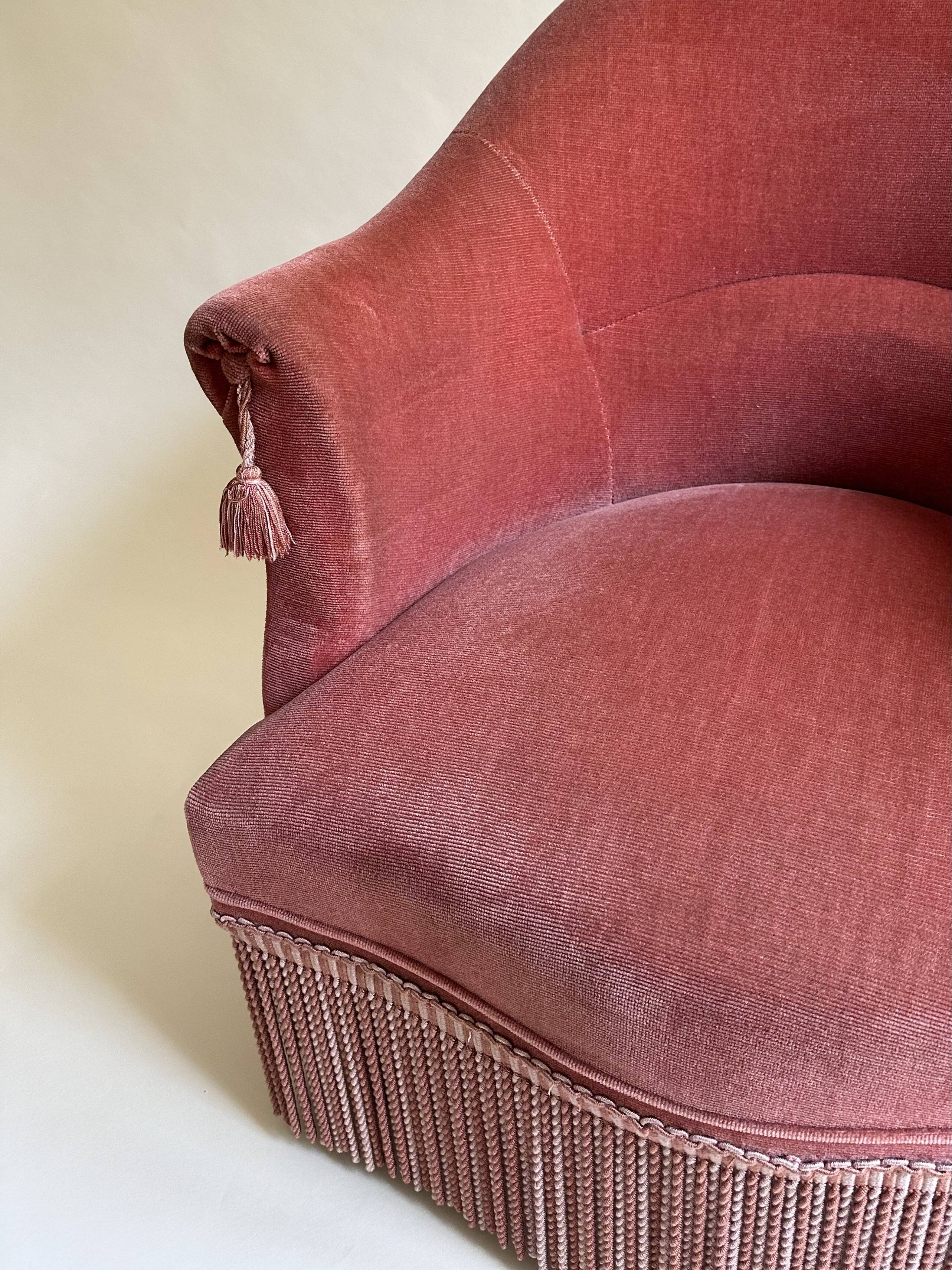 Pink-orange velvet tub chair