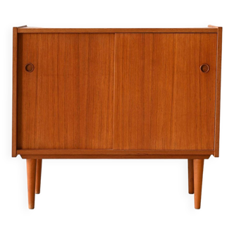 Vintage teak cabinet with sliding doors