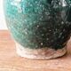 Set of two Chinese green glazed stoneware storage jars.