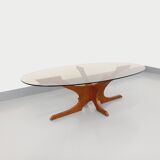 Vintage Hugues Poignant oval coffee table in teak and smoked glass from the 1970s