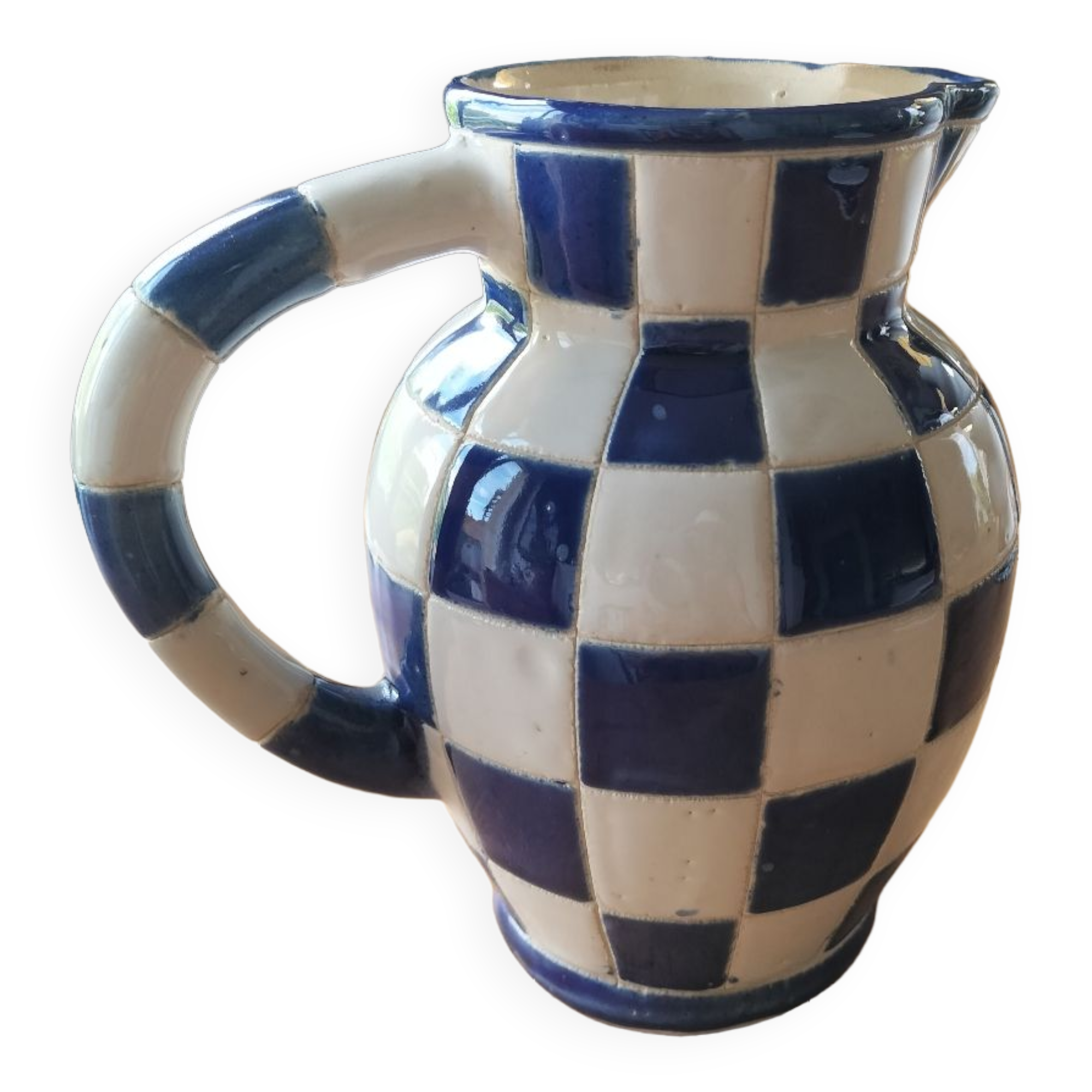 Blue and white checkerboard water pitcher