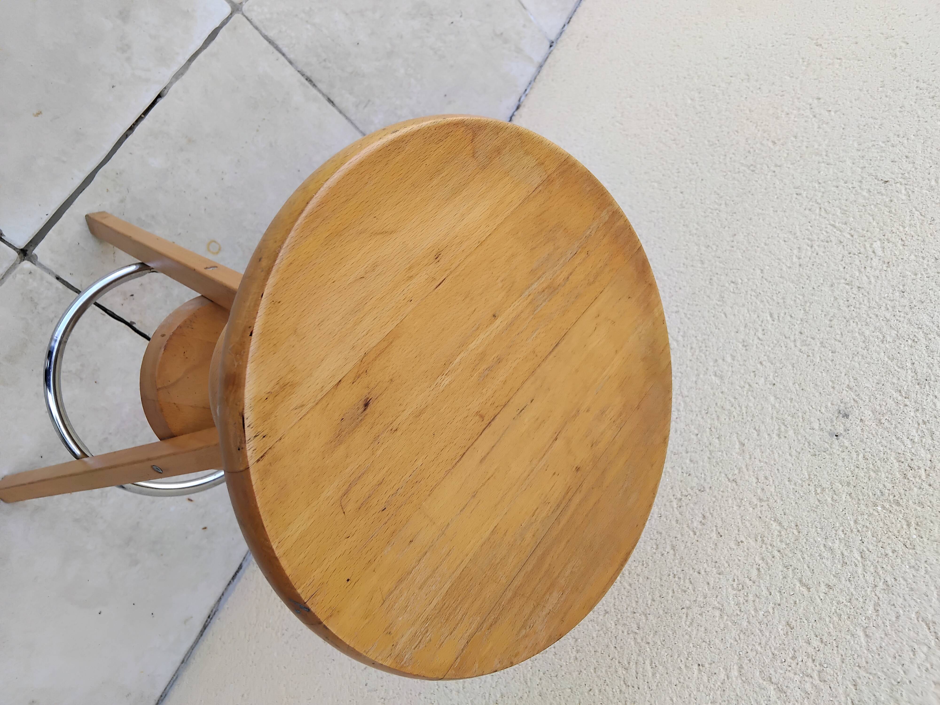 Adjustable tripod screw stool for painter artist workshop.