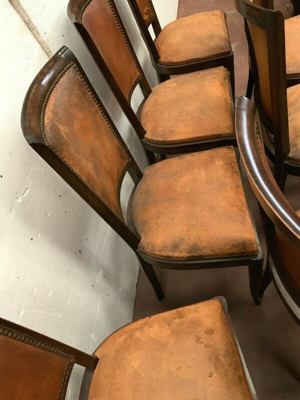 Suite of 8 seated tinted wooden chairs and tawny leather backrest 1970s