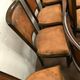 Suite of 8 seated tinted wooden chairs and tawny leather backrest 1970s