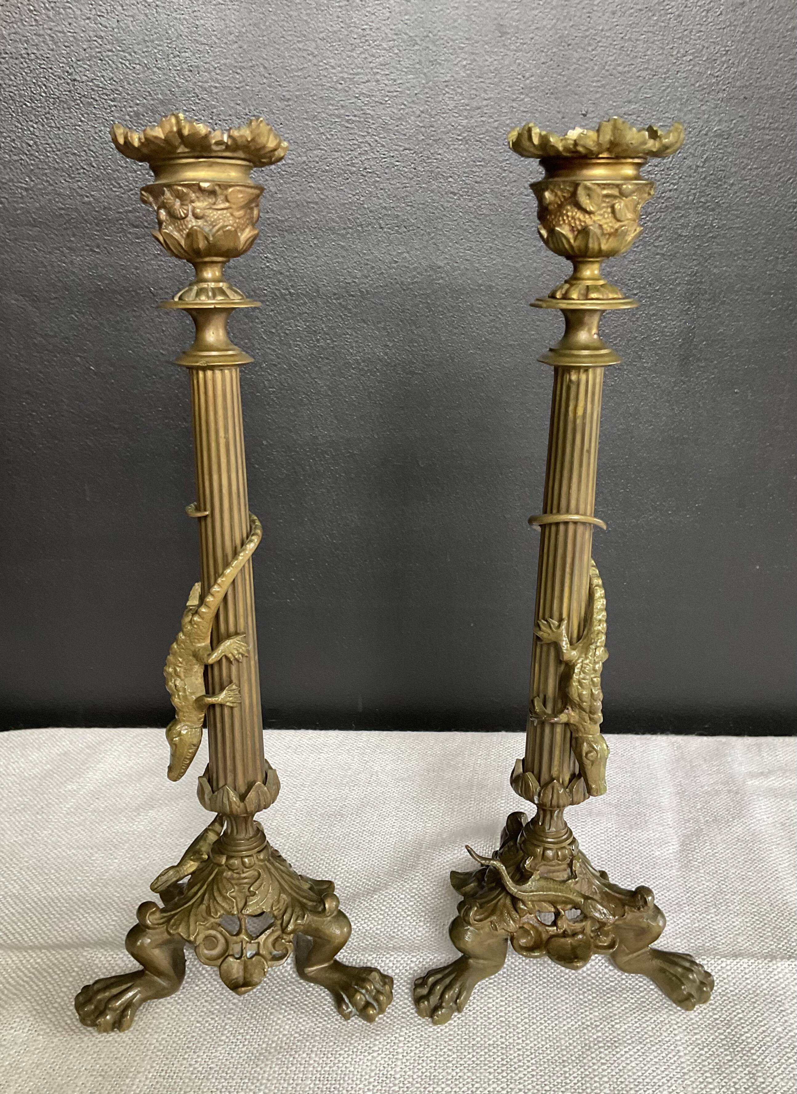 Pair of 19th-century gilded bronze candlesticks in Empire style.
