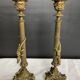 Pair of 19th-century gilded bronze candlesticks in Empire style.