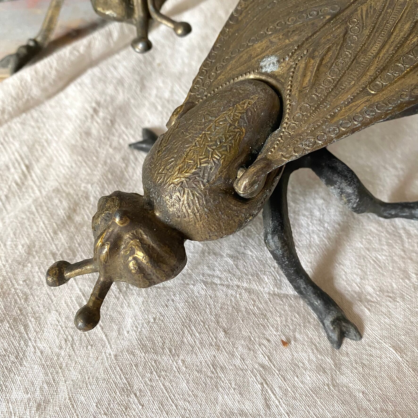 2 metal ashtrays with insect fly designs from the 1950s-60s.