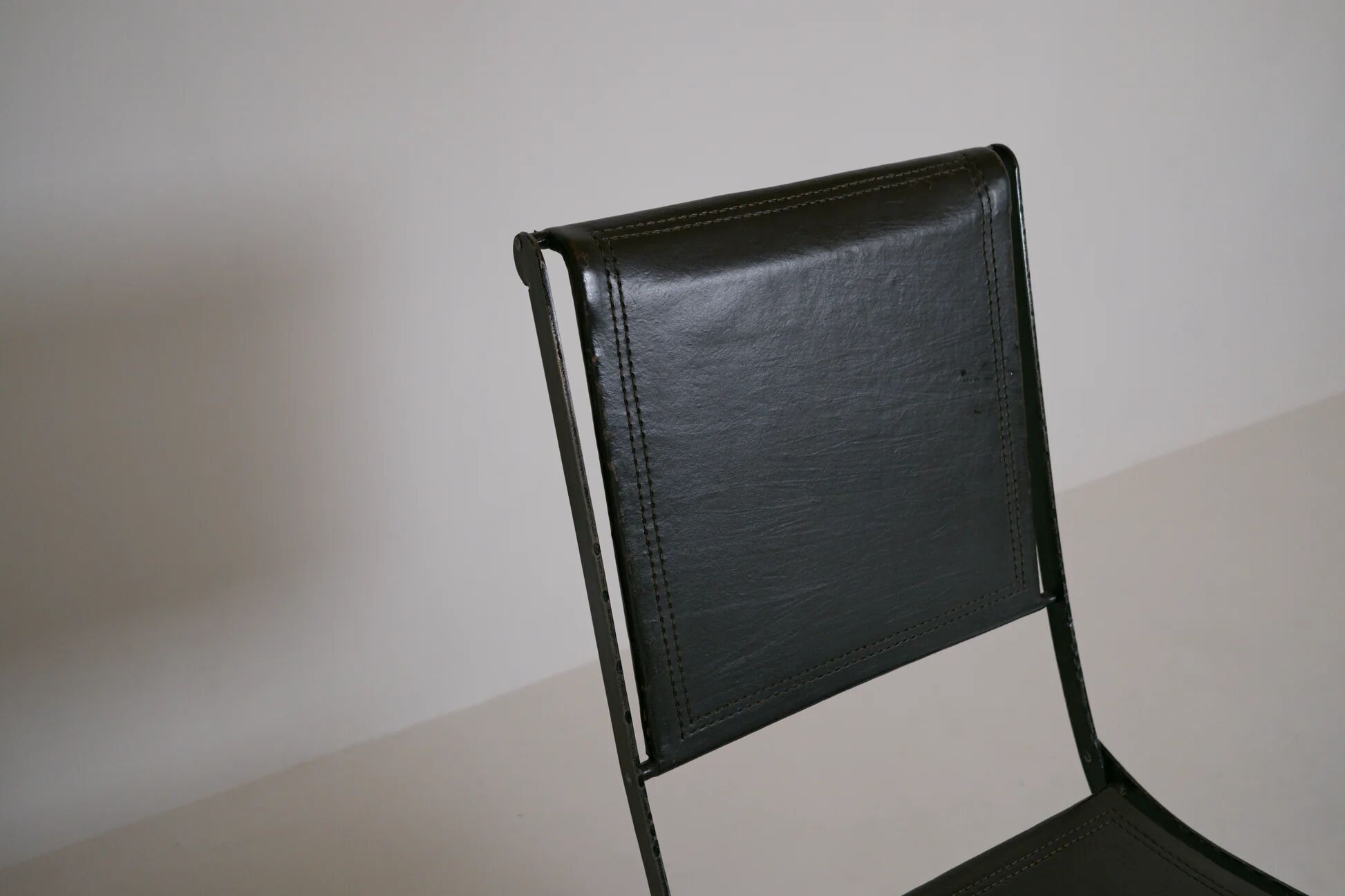 Foldable chair in wrought iron and leather. c. 1950