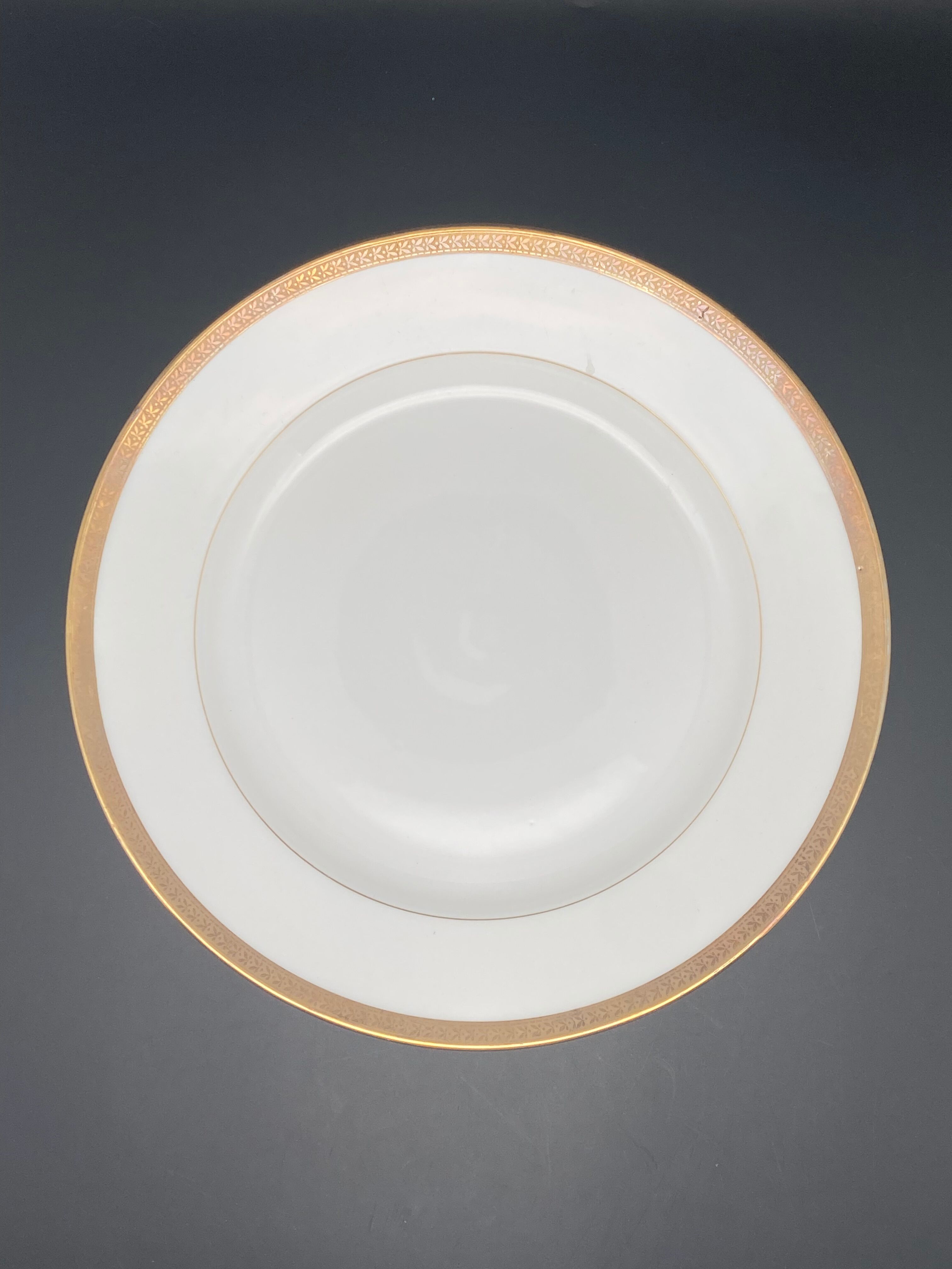 Round porcelain dish from Limoges golden tower