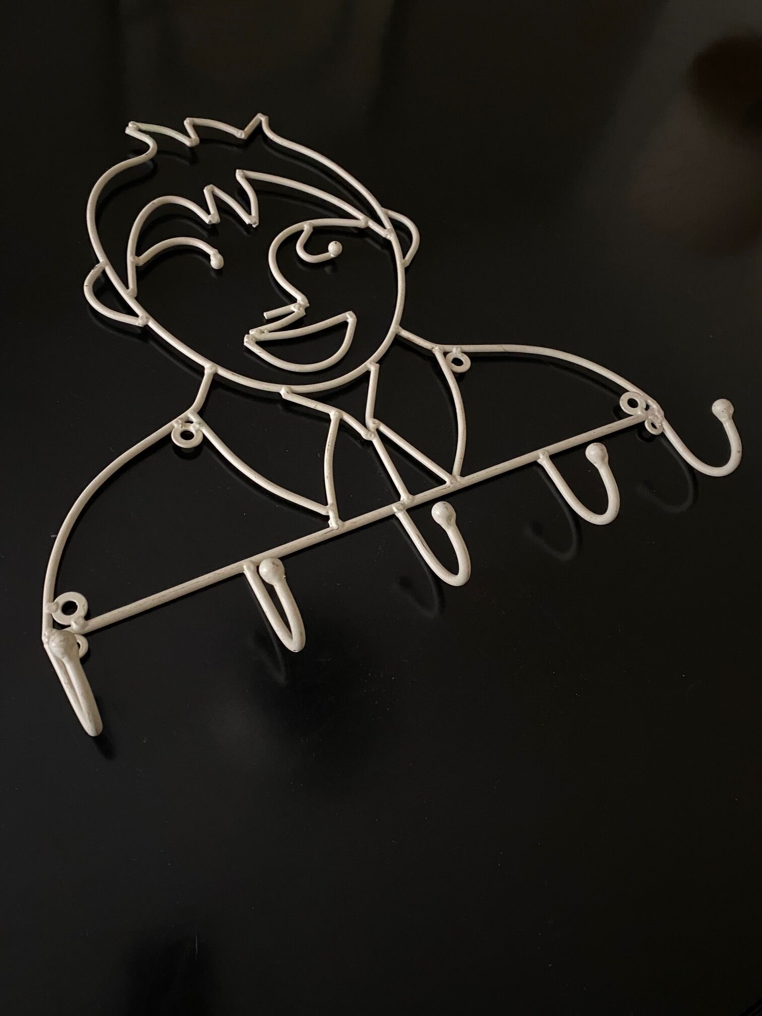 Pair of iron coat holders girl and boy