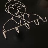 Pair of iron coat holders girl and boy